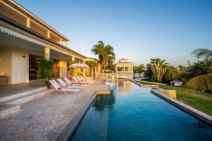 The real estate agent of Curacao offers: Luxury holiday villa for rent including a 17 m long swimming pool in Vista Royal,  Jan thiel