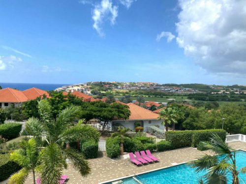 The real estate agent of Curacao offers: Apartment with swimming pool and amazing view over the Caribbean Sea, Blue Bay,  Curacao